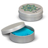 A round silver tin with a decorative lid, partially open to reveal bright blue stress putty inside.
