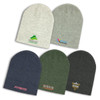 A collection of Heather Slouch Beanies in grey, navy, green, and dark charcoal, featuring various logos.