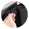 A black zippered compartment is being opened with two black zipper pulls. The fabric appears durable and textured.