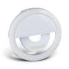 A circular white selfie phone light featuring an integrated stand and LED lights around the edge.