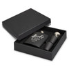A black hip flask gift set with two metal pourers, presented in a matching black box. It features branding.