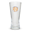 A tall, clear beer glass with a branding logo. The glass features a tapered design.