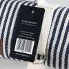 A striped picnic blanket in blue and white with a branded tag and a metal loop for easy carrying.