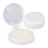 A compact white brush with a mirror, featuring an array of bristles inside its open lid.