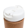A reusable coffee cup featuring a cork band and a white lid with a sipping opening.
