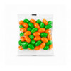 A cello bag filled with green and orange jelly beans. The bag contains a mix of vibrant, glossy candies.