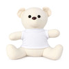 A plush calico bear in cream, featuring a white t-shirt and button-like eyes. It has a simple, friendly design.