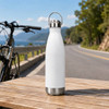 A drink bottle in white with a stainless-steel base and a hanger lid, set on a wooden table outdoors.