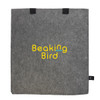 A grey felt tote bag with black handles and a logo prominently displayed in yellow and blue.
