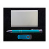 A teal pen, a silver cardholder, and a blue USB flash drive arranged on a black surface.