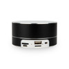 A black cylindrical speaker with USB and AUX ports on the side. It has a sleek, modern design.