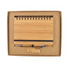 A bamboo notebook and silver pen set displayed in a kraft gift box with a black elastic band.