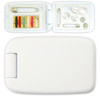 A white sewing kit with various threads, buttons, safety pins, and a needle inside a compact case.