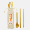 A bamboo cutlery set with a fork, knife, spoon, cleaning straw, and a natural fabric pouch. Features a logo.