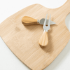 A bamboo cheese board with two stainless steel knives featuring light wooden handles.