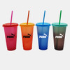 Four plastic cups in pink, orange, blue, and green with matching straws and logos.