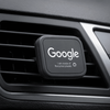 A rectangular black car vent mount featuring a logo, made from recycled plastic.