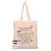 A beige tote bag featuring a black design for Father's Day, alongside a box of coloured crayons.