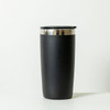 A drink bottle in matte black with a silver rim and a black lid. It features a branding logo.