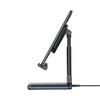 A foldable black wireless charging stand with adjustable height suitable for phones and tablets.