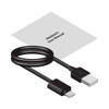 A black USB charging cable with a user manual laid beside it.