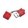 A red building block-shaped flash drive with a keychain attachment, featuring a logo.