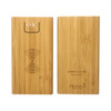 A bamboo wireless power bank in natural wood finish, featuring an LED indicator and engraved design.