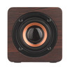 A square speaker with a wood-patterned exterior, featuring a black and copper speaker cone. It has a simple, elegant design.
