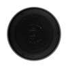 A round black speaker with a perforated surface, featuring a sleek design and a subtle logo.
