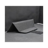 A black fabric laptop bag with a structured design and a Velcro closure. It features a textured surface.