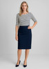 A woman wearing a striped top and a navy wool skirt, standing in a relaxed fit pose against a neutral background.