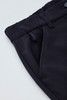 A close-up of navy women's cargo pants featuring a comfort waist and side pockets, with a logo on the fabric.