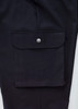 A pair of black cargo pants featuring a large side pocket with a snap closure and a smooth fabric finish.