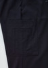 A close-up of black cargo pants featuring a large side pocket and a subtle logo on the waistband.