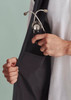 A black vest with a zip front featuring a pocket holding a stethoscope.