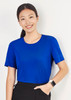 A women's short sleeve jersey top in bright blue, featuring a classic round neckline and a logo on the sleeve.