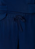 Navy blue women's straight leg scrub pants featuring a drawstring waist and pockets. Branding is present on the fabric.