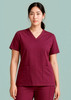 Burgundy women's V-neck scrub top featuring short sleeves and front pockets. The model is standing against a light green background.