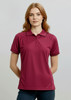 A maroon women's short sleeve polo shirt with a collar and a logo. The shirt features a fitted design and short sleeves.