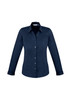 A women's long sleeve button-up shirt in navy blue, featuring a fitted design and a collar, with a logo present.