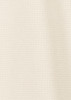A light cream short sleeve shirt with a textured pattern and a logo.