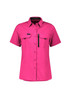 A pink short sleeve shirt with a button-up front and two chest pockets, featuring a zippered pocket and a logo.
