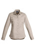 A women's long sleeve shirt in a light beige colour, featuring a collar, buttons, and a chest pocket. It has a logo.