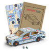 A wooden model of a sedan car in blue and white, featuring an airport shuttle service design and assembly instructions.