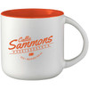 A ceramic mug with an orange interior and white exterior, featuring a logo on the side.