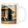 A coffee mug featuring a large yellow mining truck on a rocky background, with a white ceramic finish and a handle.