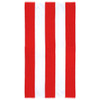 A cotton beach towel featuring bold red and white vertical stripes. It has a logo embossed on one side.