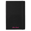 A black journal with an elastic band, featuring a custom name in pink text at the bottom. It includes a branding logo.