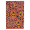 A vibrant red journal with Indigenous-inspired floral and dot designs, featuring an elastic band closure.