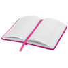 An open notebook with lined pages and a bright pink cover, featuring a matching ribbon bookmark.